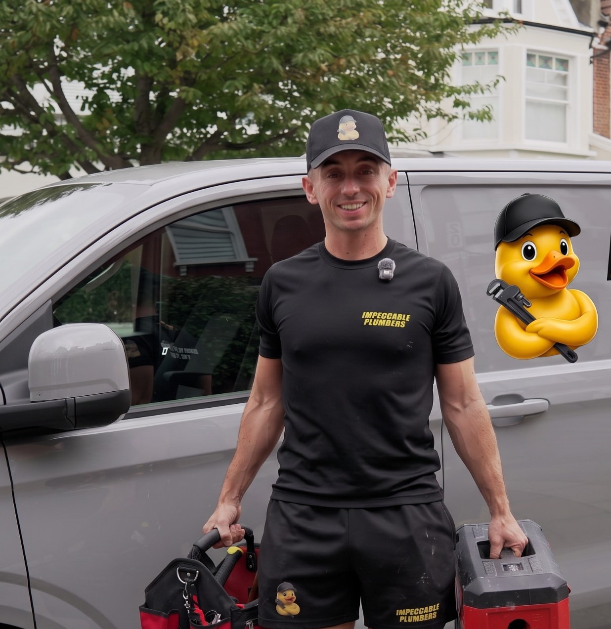 Sonny, lead plumber at Impeccable Plumbers, holding his tool bags in front of the company van